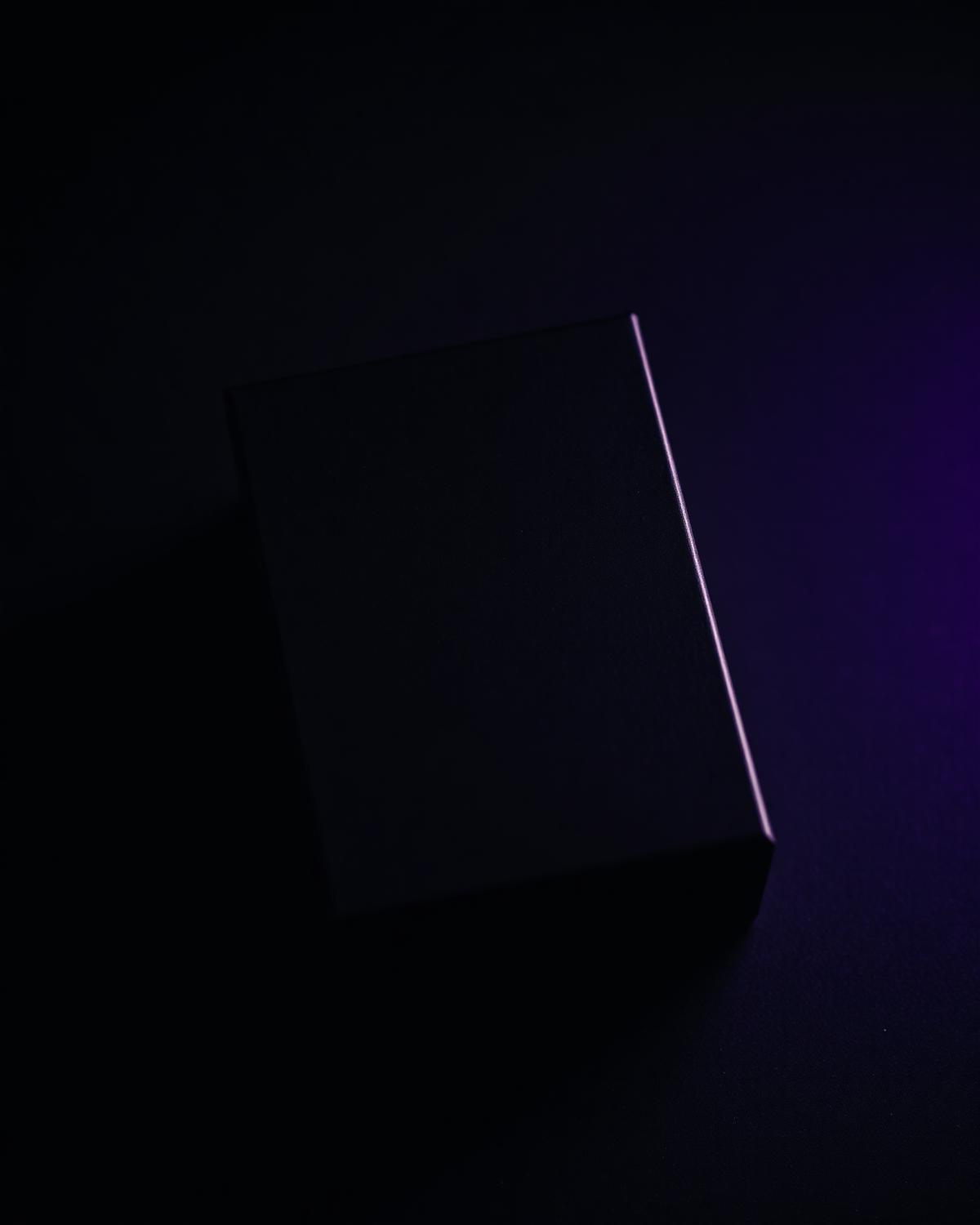Matte black packaging box under raking light