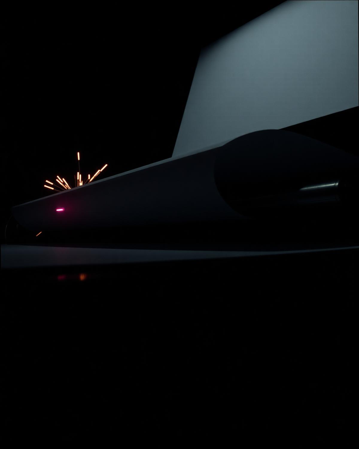 Detail of press machinery in near-black light